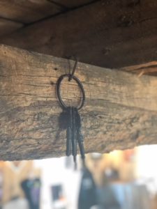 Key hanging on beam in Red Barn